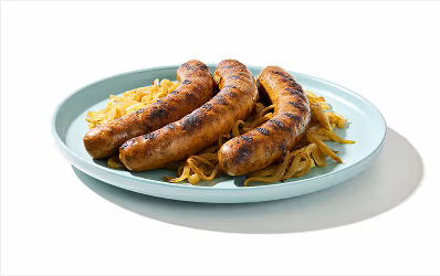 Three sausages on a bed of sautéed onions.