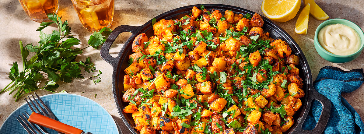 Overhead shots skillet potatoes topped with parsley