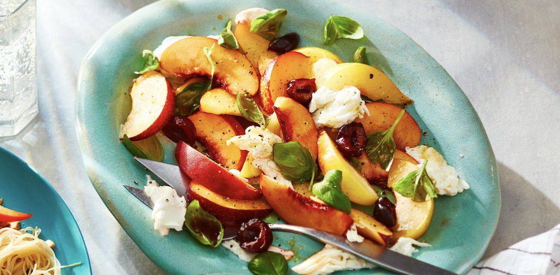 Bowl of stone fruit caprese salad