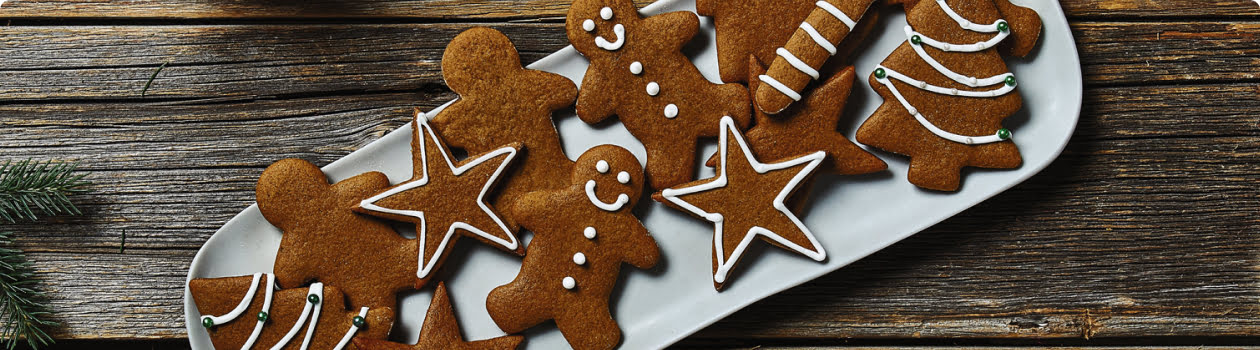 Assortment of gingerbread cookies on a white platter