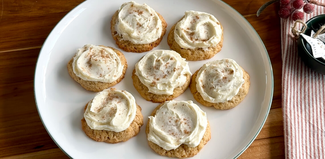  Frosted eggnog spiced cookies on a white plate