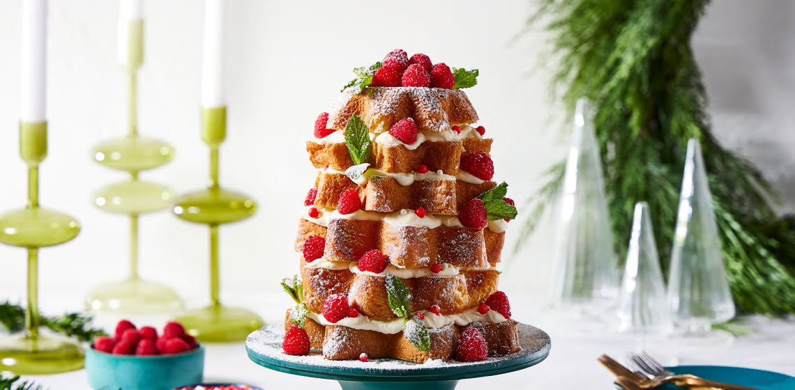 Stacked baked panettone shaped like a Christmas tree