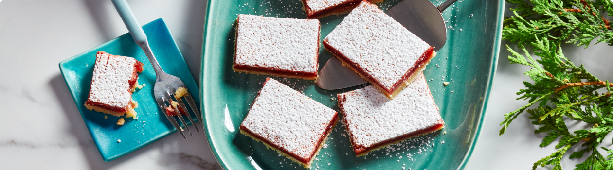 Lemon cranberry squares on a turquoise plate