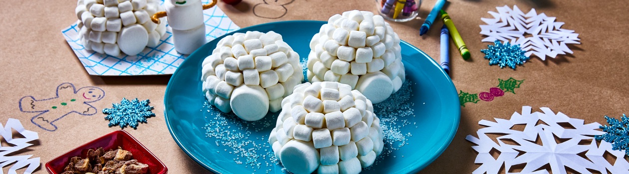 Igloo Hazelnut cupcakes on a blue plate on craft paper