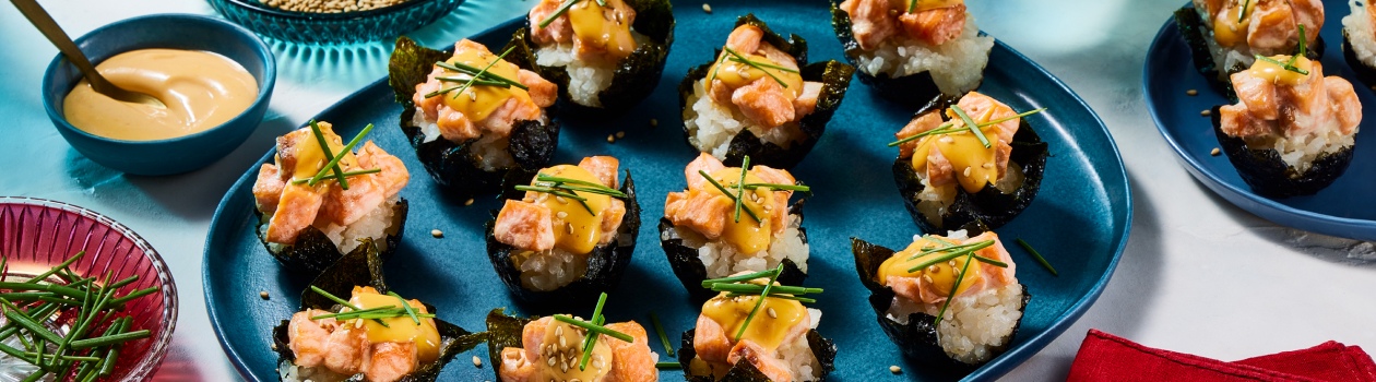 Plate of sushi baked cups topped with salmon