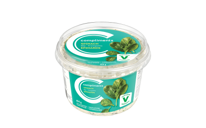 A clear tub of Compliments spinach dip