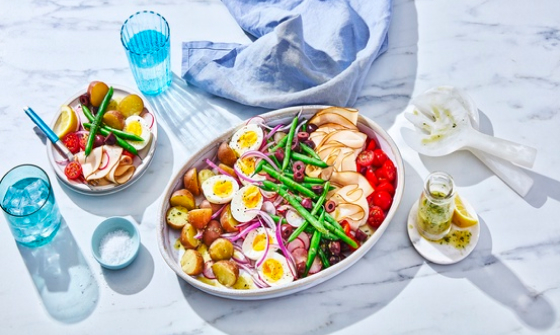 Platter of niÃƒÆ’Ã‚Â§oise salad with beans, hard-boiiled eggs, potatoes, radish, tomatoes, olives and cured meats