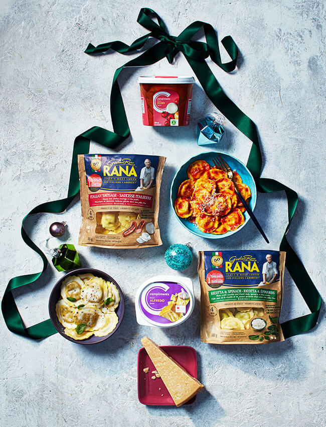 flat-lay of pasta sauces and pastas inside a ribbon christmas tree outline