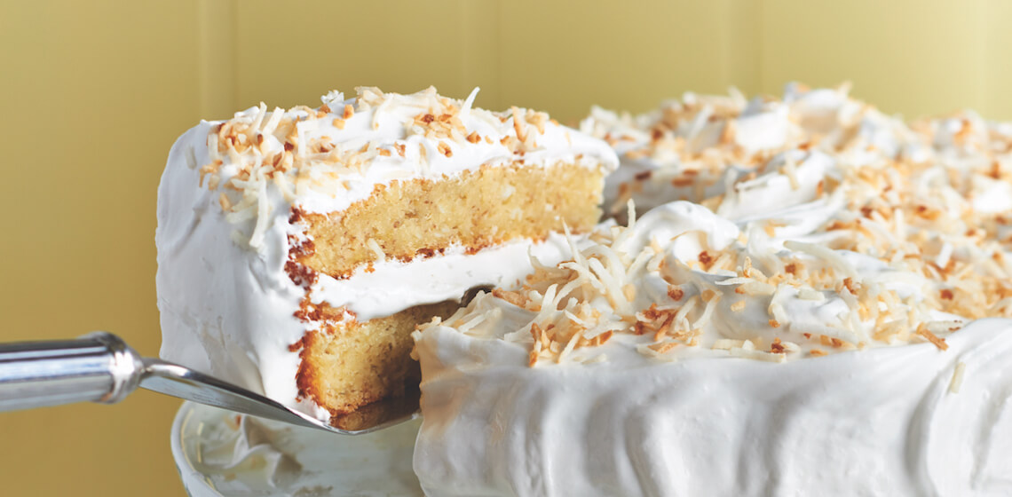 Slice of Banana-coconut cake on cake lifter