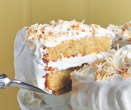 Slice of Banana-coconut cake on cake lifter