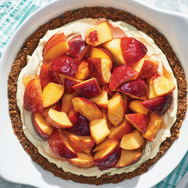  Slices of fresh peach over a cream cheese filling and cookie crust.